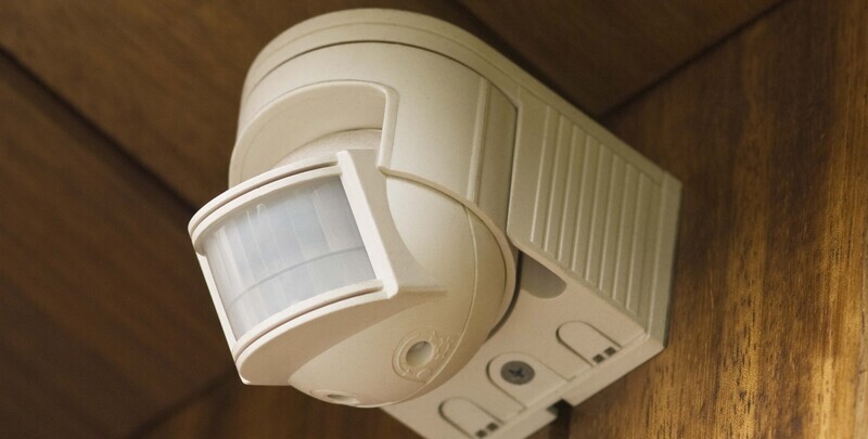 Motion sensor security light installed on a wall.