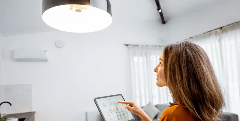 Woman operating smart lighting