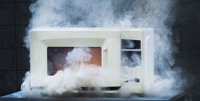 A microwave oven on fire